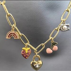 Coach charmed gold tone necklace